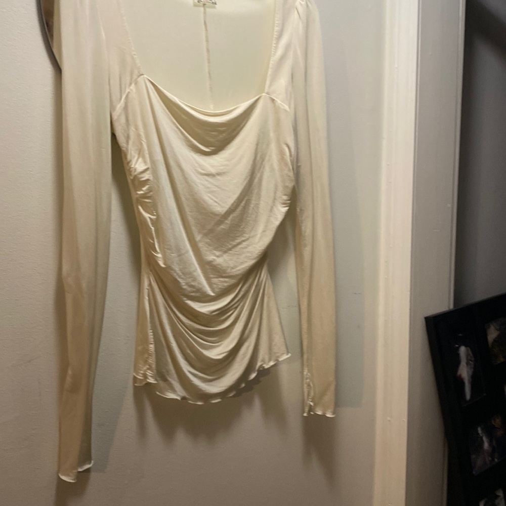 Silky Free People Off white slim cut, but stretchy blouse